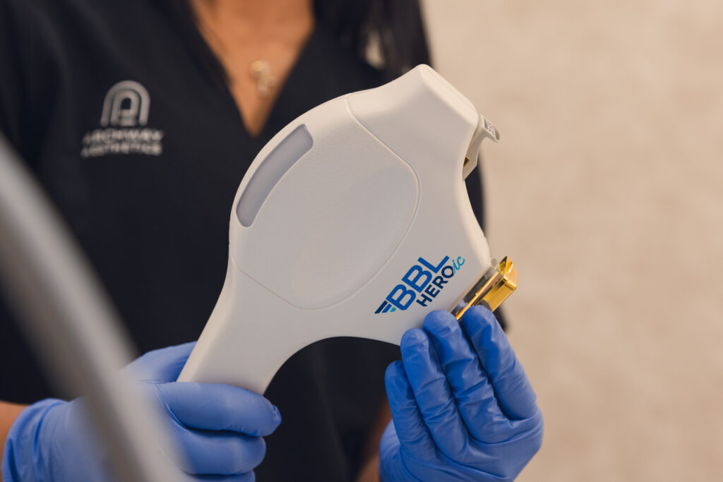 A Provider at Archway Aesthetics prepares the handheld device for BBL treatment for the face in Las Vegas.