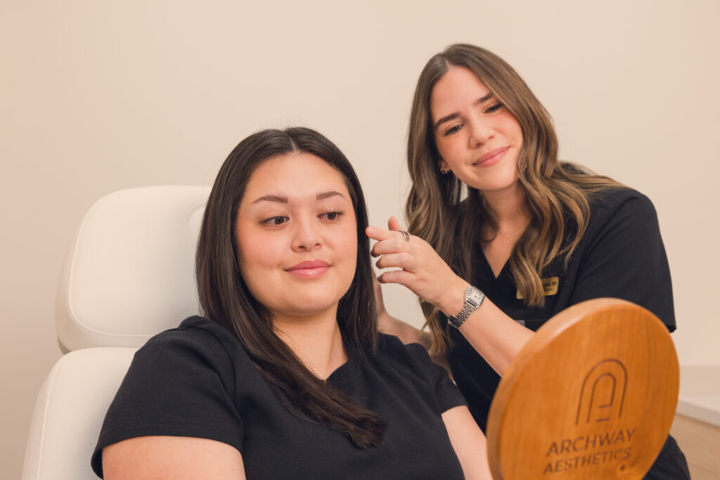 Client receiving consultation treatment at Archway Aesthetics for facial rejuvenation and wrinkle reduction.